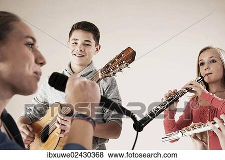 Teenagers making music together View Large Photo Image Stock Photo - Teenagers making music together. Fotosearch