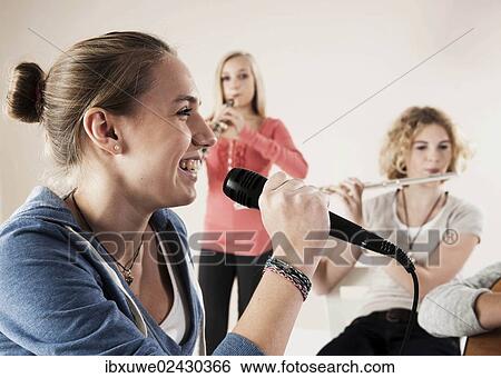 Stock Photograph - Teenagers making music together. Fotosearch