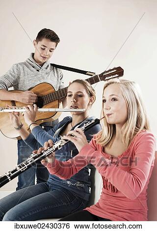 Teenagers making music together View Large Photo Image Stock Photograph - Teenagers making music together. Fotosearch