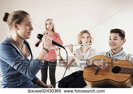 Teenagers making music together View Large Photo Image Stock Photography - Teenagers making music together. Fotosearch