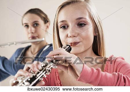 Stock Photography - Teenagers making music together. Fotosearch