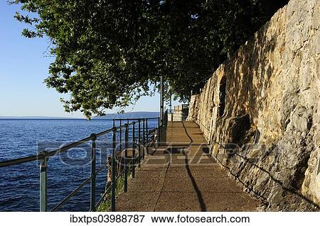 "The boardwalk trail along the rocky coast, Lovran, Istria, Croatia, Europe" View Large Photo Image Stock Photo - "The boardwalk trail along the rocky coast, Lovran, Istria, Croatia, Europe". Fotosearch