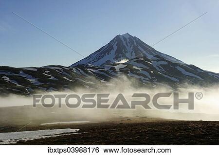Stock Photograph - "The extinct Tolmachev Dol volcano in the morning light, Kamchatka Peninsula, Russia, Europe". Fotosearch