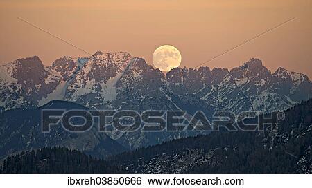 "The full moon rising over the Kaiser Mountains, Tyrol, Austria, Europe" View Large Photo Image Stock Photograph - "The full moon rising over the Kaiser Mountains, Tyrol, Austria, Europe". Fotosearch