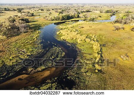 Stock Photo - "The Gomoti River with its adjoining freshwater marshland, aerial view, Okavango Delta, Botswana, Africa". Fotosearch