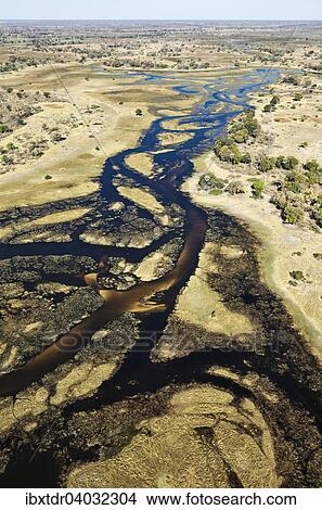 Picture - "The Gomoti River with its channels, islands, sandbanks and adjoining freshwater marshland, aerial view, Okavango Delta, Botswana, Africa". Fotosearch