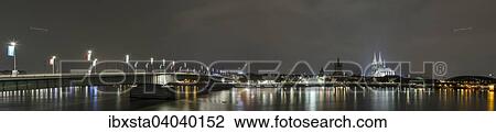 "The illuminated Cologne Cathedral and Hohenzollern Bridge at night with Rhine, Deutz, Cologne, North Rhine-Westphalia, Germany, Europe" View Large Photo Image Stock Image - "The illuminated Cologne Cathedral and Hohenzollern Bridge at night with Rhine, Deutz, Cologne, North Rhine-Westphalia, Germany, Europe". Fotosearch