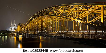 "The illuminated Cologne Cathedral and Hohenzollern Bridge at night with Rhine, Deutz, Cologne, North Rhine-Westphalia, Germany, Europe" View Large Photo Image Stock Photo - "The illuminated Cologne Cathedral and Hohenzollern Bridge at night with Rhine, Deutz, Cologne, North Rhine-Westphalia, Germany, Europe". Fotosearch