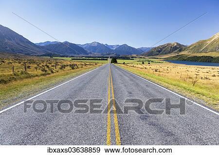 Stock Photo - "The long straight West Coast Road 73 passing Lake Grasmere, Mt. Horrible, 1234m, at the rear, Canterbury Region, New Zealand, Oceania". Fotosearch