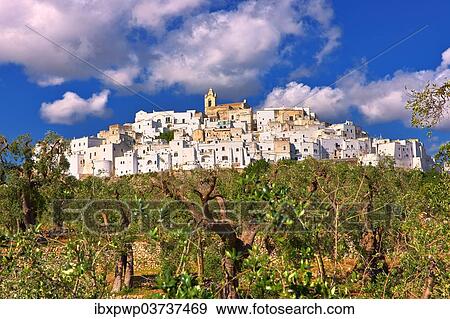 Stock Photo - "The medieval fortified hill town of Ostuni, also """"La Citta Bianca"""", """"The White Town"""", Ostuni, Apulia, Italy, Europe". Fotosearch