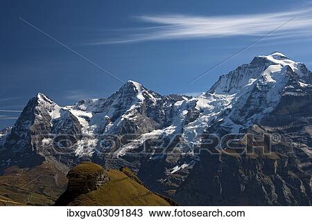 Stock Image - "The mountains Eiger, Monch and Jungfrau in the Bernese Alps, Berner Oberland, Murren, Canton of Bern, Switzerland, Europe". Fotosearch