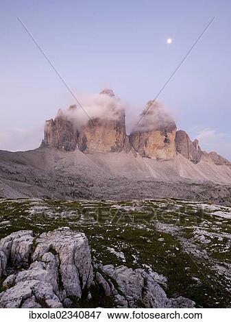 Stock Photo - "The peaks of Tre Cime di Lavaredo at dawn, Dolomiti di Sesto National Park, Sexten Dolomites, Hochpustertal, High Puster Valley, South Tyrol, Italy, Europe". Fotosearch