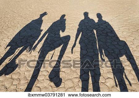 "The shadows of people on dry salt pan, Dead Pan, Sossusvlei, Namib Desert, Namibia, Africa" View Large Photo Image Stock Image - "The shadows of people on dry salt pan, Dead Pan, Sossusvlei, Namib Desert, Namibia, Africa". Fotosearch
