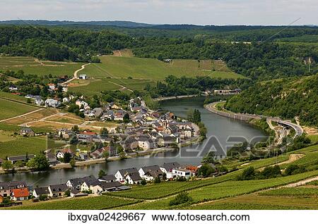 Stock Photo - "The town of Machtum on a loop of the Moselle river, Moselle Valley, Luxembourg, Europe". Fotosearch