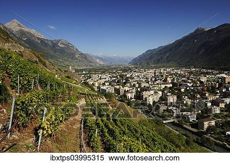 "The town of Martigny, surrounded by vineyards, Martigny, Canton of Valais, Switzerland, Europe" View Large Photo Image Stock Photography - "The town of Martigny, surrounded by vineyards, Martigny, Canton of Valais, Switzerland, Europe". Fotosearch