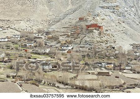 Stock Photography - "The village of Geling with the Tashi Choling Gompa, fields at front, Gieling, Upper Mustang, Lo, Nepal, Asia". Fotosearch