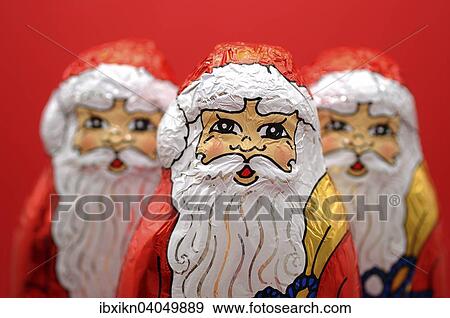 Three chocolate Santas View Large Photo Image Stock Photo - Three chocolate Santas. Fotosearch