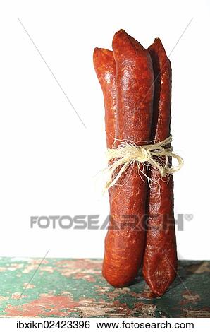 Stock Photograph - Three salami tied together. Fotosearch