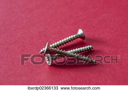 Stock Image - Three wood screws. Fotosearch