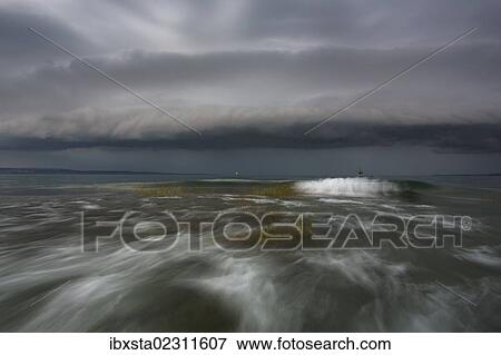 "Thundercloud, shelf cloud, with storm and waves on Lake Constance near Konstanz, Baden-Wuerttemberg, Germany, Europe" View Large Photo Image Stock Photo - "Thundercloud, shelf cloud, with storm and waves on Lake Constance near Konstanz, Baden-Wuerttemberg, Germany, Europe". Fotosearch