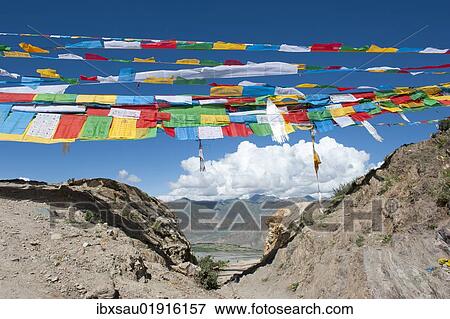 "Tibetan Buddhism, prayer flags waving above the entrance to the pilgrims' path, Kora pilgrimage around the Ganden Monastery, Himalaya Range, Central Tibet, Ue-Tsang, Tibet Autonomous Region, People's Republic of China, Asia" View Large Photo Image Stock Photo - "Tibetan Buddhism, prayer flags waving above the entrance to the pilgrims' path, Kora pilgrimage around the Ganden Monastery, Himalaya Range, Central Tibet, Ue-Tsang, Tibet Autonomous Region, People's Republic of China, Asia". Fotosearch