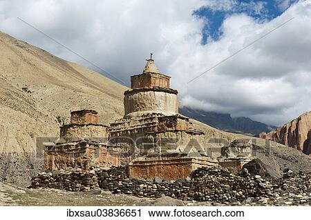 Stock Image - "Tibetan Buddhism, weathered stupa in eroded landscape, Ghami, Upper Mustang, Nepal, Asia". Fotosearch