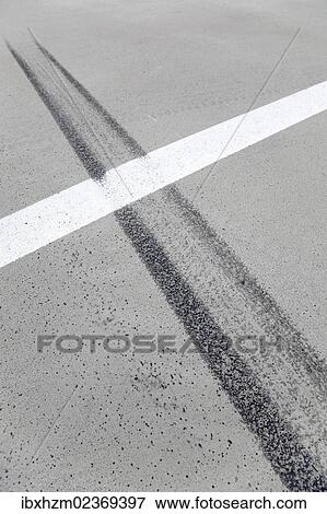 Stock Photo - "Tire tracks, skid marks on a parking lot". Fotosearch