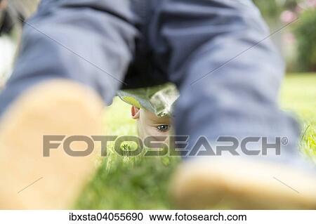 "Toddler, 18 months, playing in the garden" View Large Photo Image Stock Image - "Toddler, 18 months, playing in the garden". Fotosearch