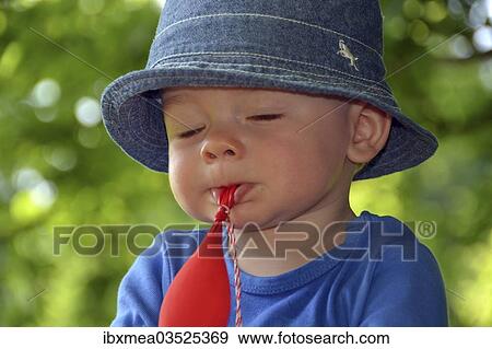 "Toddler playing absent-minded with a balloon, Germany, Europe" View Large Photo Image Stock Photo - "Toddler playing absent-minded with a balloon, Germany, Europe". Fotosearch