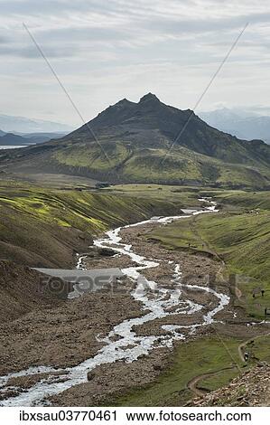 Stock Image - "Tofadindar Mountain with a wild river, mountain landscape at Alftavatn, Laugavegur trekking route, Highlands, Suourland, Iceland, Europe". Fotosearch