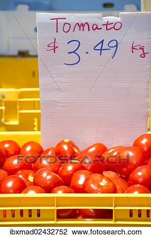 Tomatoes in a yellow basket with a price tag View Large Photo Image Stock Image - Tomatoes in a yellow basket with a price tag. Fotosearch