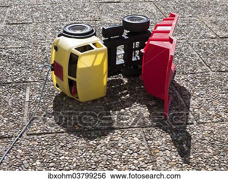"Toppled over toy dumper truck, Germany, Europe" View Large Photo Image Stock Photograph - "Toppled over toy dumper truck, Germany, Europe". Fotosearch