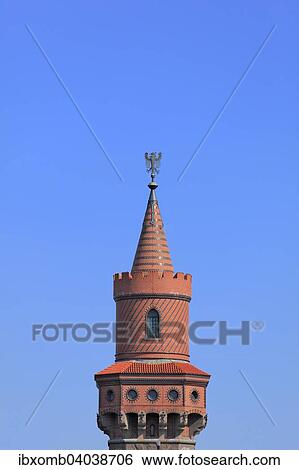 Stock Photograph - "Tower of Oberbaumbrucke bridge, South Tower, with the Brandenburg eagle, Friedrichshain-Kreuzberg districts, Berlin, Germany, Europe". Fotosearch