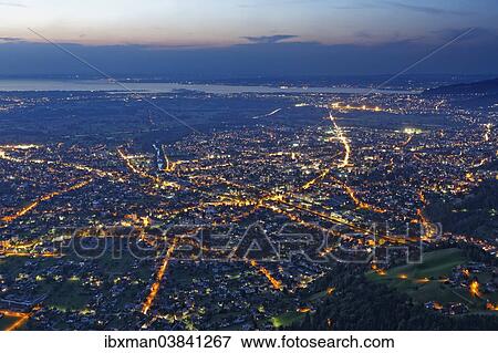 "Townscape of Dornbirn in the evening, Lake Constance at the back, seen from Karren mountain, Dornbirn, Vorarlberg, Rhine Valley, Austria, Europe" View Large Photo Image Stock Photo - "Townscape of Dornbirn in the evening, Lake Constance at the back, seen from Karren mountain, Dornbirn, Vorarlberg, Rhine Valley, Austria, Europe". Fotosearch