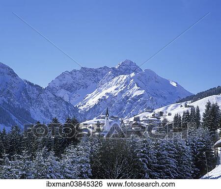 "Townscape of Hirschegg, Grosser Widderstein mountain at the back, Kleinwalsertal valley, Allgau Alps, Vorarlberg, Austria, Europe" View Large Photo Image Stock Photograph - "Townscape of Hirschegg, Grosser Widderstein mountain at the back, Kleinwalsertal valley, Allgau Alps, Vorarlberg, Austria, Europe". Fotosearch