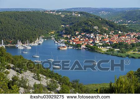 Stock Photography - "Townscape with sailing ships in the foreground, River Krka, Skradin, Dalmatia, Croatia, Europe". Fotosearch