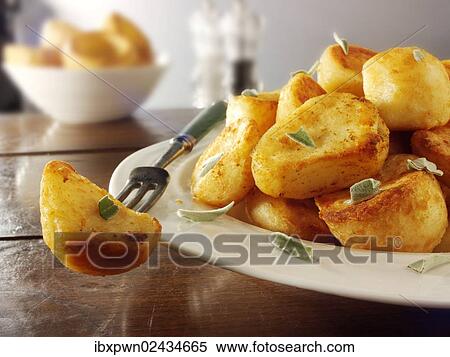 Traditional British roast potatoes View Large Photo Image Stock Photography - Traditional British roast potatoes. Fotosearch