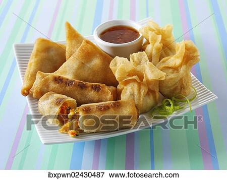 "Traditional Chinese spring rolls, samosas and dim sum" View Large Photo Image Stock Photo - "Traditional Chinese spring rolls, samosas and dim sum". Fotosearch