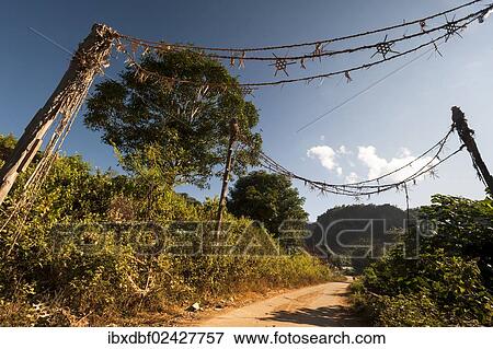 "Traditional gate at the entrance to the village, Soppong or Pang Mapha area, Mae Hong Son province, northern Thailand, Thailand, Asia" View Large Photo Image Stock Photo - "Traditional gate at the entrance to the village, Soppong or Pang Mapha area, Mae Hong Son province, northern Thailand, Thailand, Asia". Fotosearch