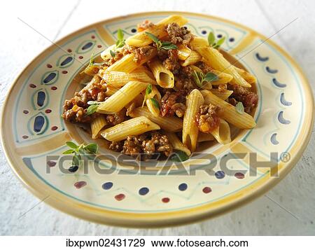 Traditional Penne pasta with bolognese sauce View Large Photo Image Stock Photo - Traditional Penne pasta with bolognese sauce. Fotosearch