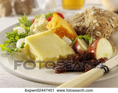 Traditional Ploughman's lunch with Cheddar and Lancashire cheese View Large Photo Image Stock Image - Traditional Ploughman's lunch with Cheddar and Lancashire cheese. Fotosearch
