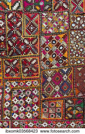 "Traditional wall hanging from Rajasthan, colourful, inlaid with mirrors and different patterns, detail, Udaipur, Rajasthan, India, Asia" View Large Photo Image Stock Image - "Traditional wall hanging from Rajasthan, colourful, inlaid with mirrors and different patterns, detail, Udaipur, Rajasthan, India, Asia". Fotosearch