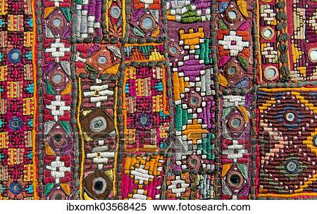 "Traditional wall hanging from Rajasthan, colourful, inlaid with mirrors and different patterns, detail, Udaipur, Rajasthan, India, Asia" View Large Photo Image Stock Photography - "Traditional wall hanging from Rajasthan, colourful, inlaid with mirrors and different patterns, detail, Udaipur, Rajasthan, India, Asia". Fotosearch