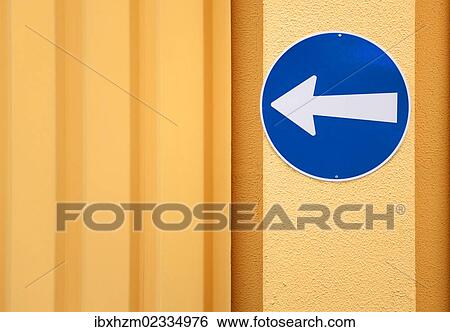 "Traffic sign, arrow to the left, on the wall of a building" View Large Photo Image Stock Photograph - "Traffic sign, arrow to the left, on the wall of a building". Fotosearch