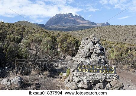 "Trekking, sign, route to Kibo Hut, near the Horombo Huts, Mt Mawenzi at back, Marangu Route, Mt. Kilimanjaro, Tanzania, East Africa, Africa" View Large Photo Image Picture - "Trekking, sign, route to Kibo Hut, near the Horombo Huts, Mt Mawenzi at back, Marangu Route, Mt. Kilimanjaro, Tanzania, East Africa, Africa". Fotosearch