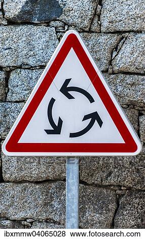 "Triangular red and white road sign, roundabout" View Large Photo Image Stock Photo - "Triangular red and white road sign, roundabout". Fotosearch