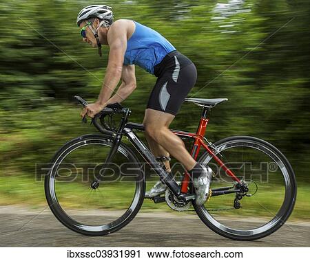"Triathlete, 45 years, cycling, Kaiserstrassle road, Baden-Wurttemberg, Germany, Europe" View Large Photo Image Stock Image - "Triathlete, 45 years, cycling, Kaiserstrassle road, Baden-Wurttemberg, Germany, Europe". Fotosearch
