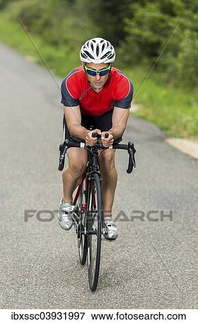 "Triathlete, 45 years, cycling, Kaiserstrassle road, Baden-Wurttemberg, Germany, Europe" View Large Photo Image Stock Photo - "Triathlete, 45 years, cycling, Kaiserstrassle road, Baden-Wurttemberg, Germany, Europe". Fotosearch