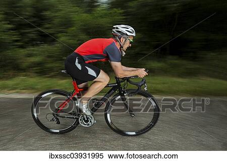 "Triathlete, 45 years, cycling, Kaiserstrassle road, Baden-Wurttemberg, Germany, Europe" View Large Photo Image Stock Photography - "Triathlete, 45 years, cycling, Kaiserstrassle road, Baden-Wurttemberg, Germany, Europe". Fotosearch