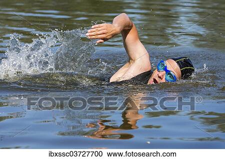 "Triathlete swimming, Welzheim, Baden-Wurttemberg, Germany, Europe" View Large Photo Image Stock Image - "Triathlete swimming, Welzheim, Baden-Wurttemberg, Germany, Europe". Fotosearch